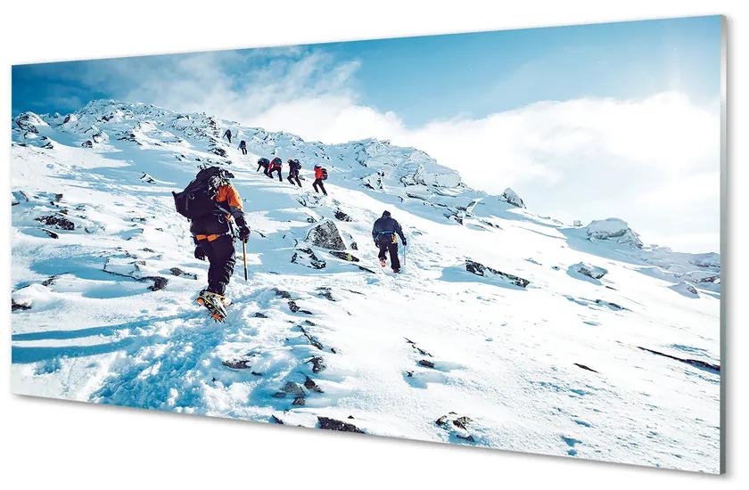 Obraz plexi Lezenie na hory v zime 125x50 cm