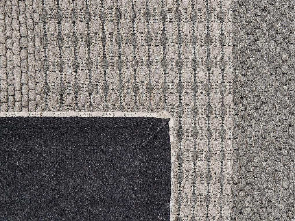 Vlnený koberec 140 x 200 cm modrá/sivá AKKAYA Beliani