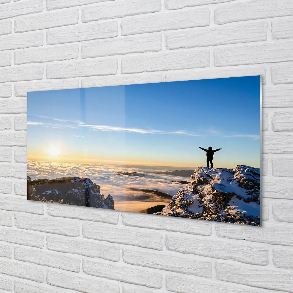 Obraz plexi Mountain muž mraky východ 100x50 cm