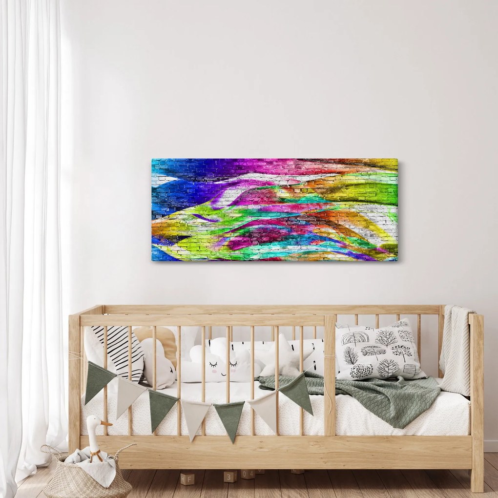 Obraz - Tehlový múr s farebnými plameňmi (120x50 cm)