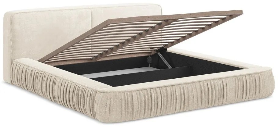 Krémová čalúnená dvojlôžková posteľ s úložným priestorom s roštom 180x200 cm Keoni – Makamii