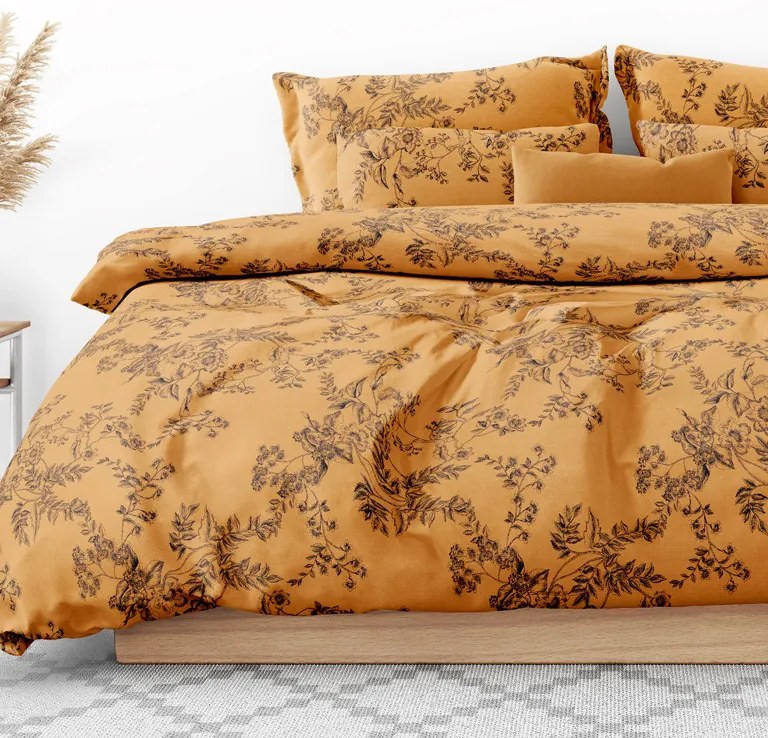 Goldea bavlnené posteľné obliečky - čierne kvety na tmavo oranžovom 140 x 220 a 70 x 90 cm