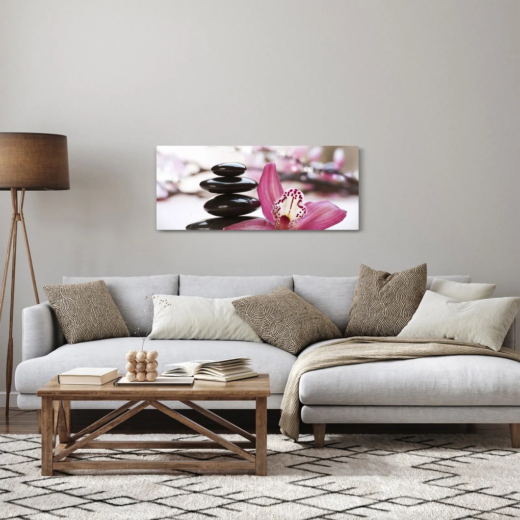 Obraz masážnych kameňov a orchidey na vode (120x50 cm)