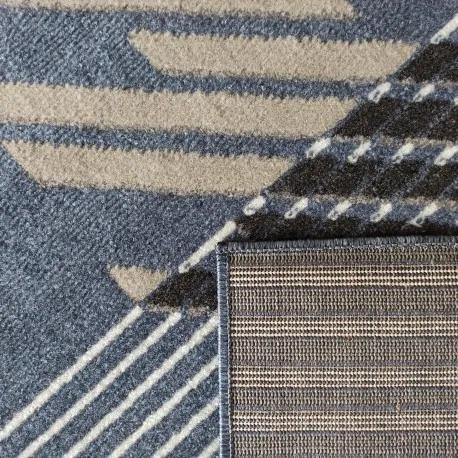 Dizajnový koberec modrej farby s pruhmi
