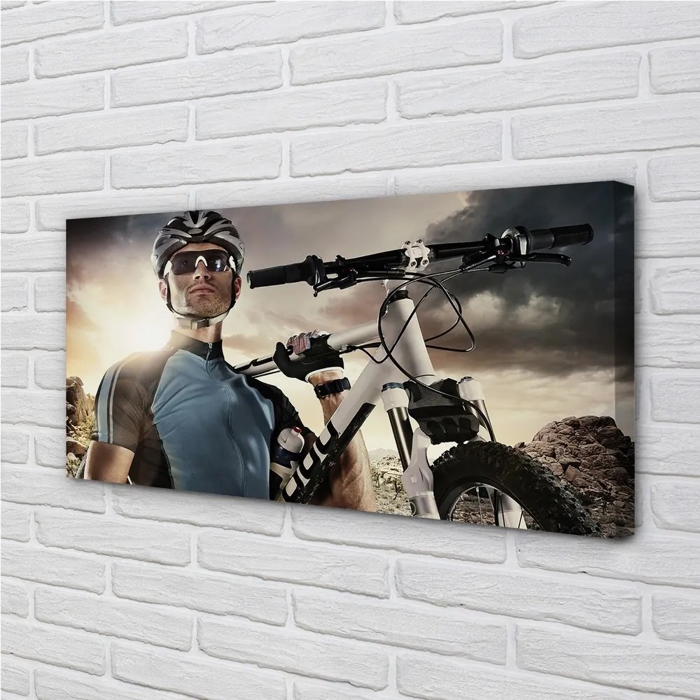 Obraz canvas Cyklista na bicykli mraky 120x60 cm