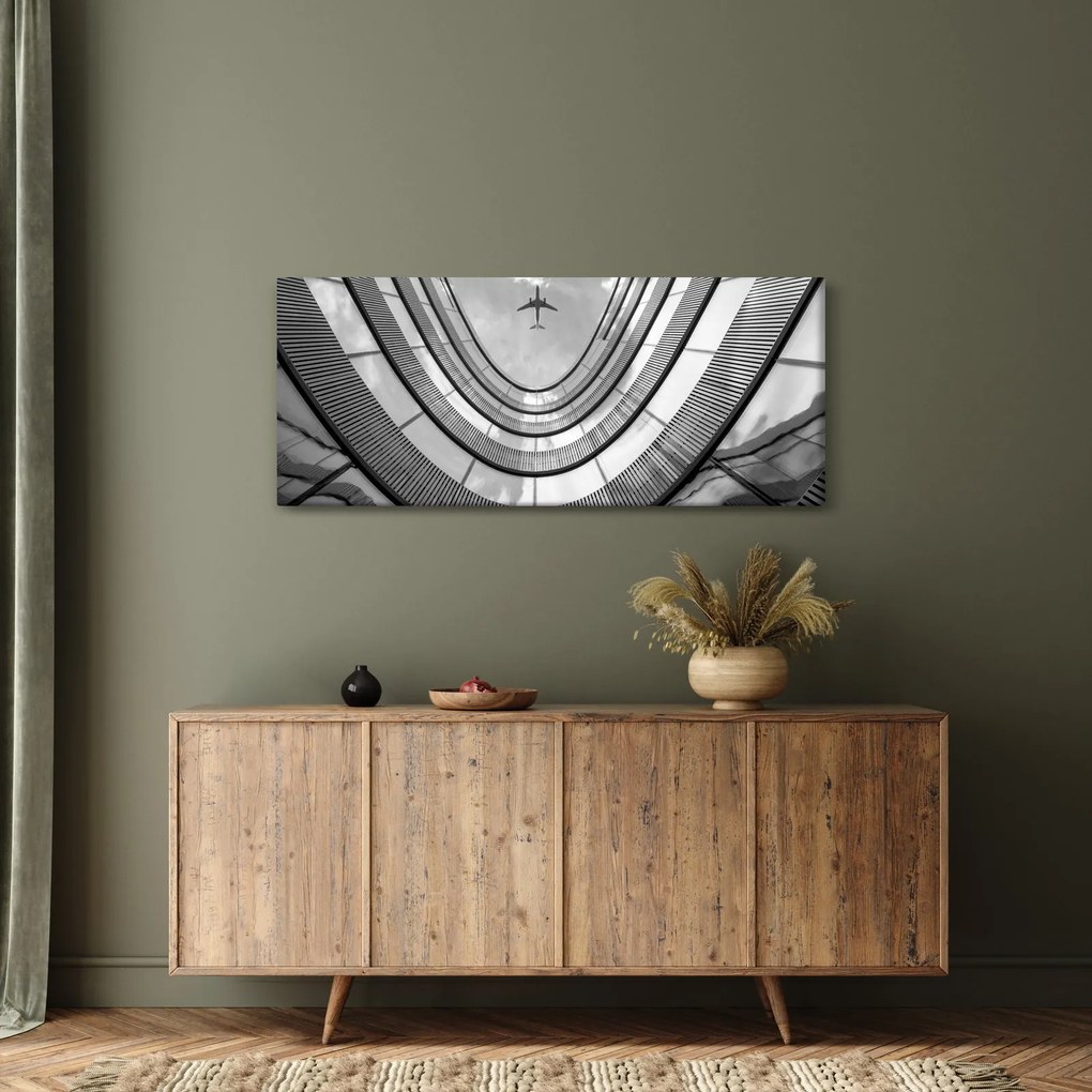 Obraz - Lietadlo nad budovou (120x50 cm)