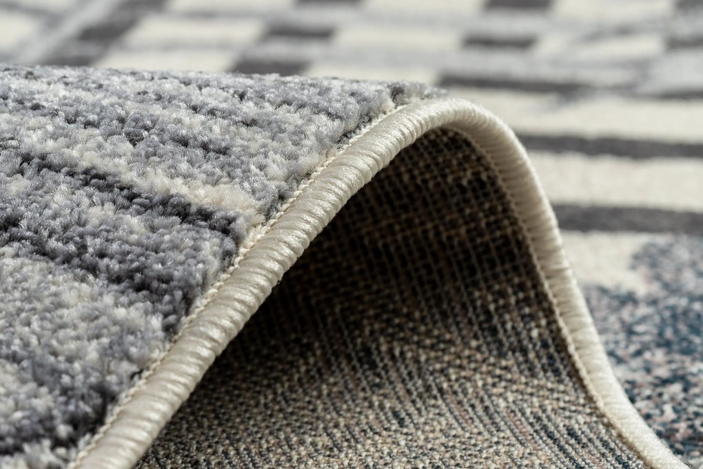 Koberec HEOS 78540 krémovo / modrý LISTY DŽUNGLE