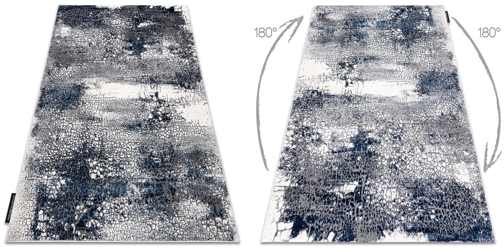 Moderný koberec DE LUXE 528 Abstrakcia - Štrukturálny krém / tmavomodrý