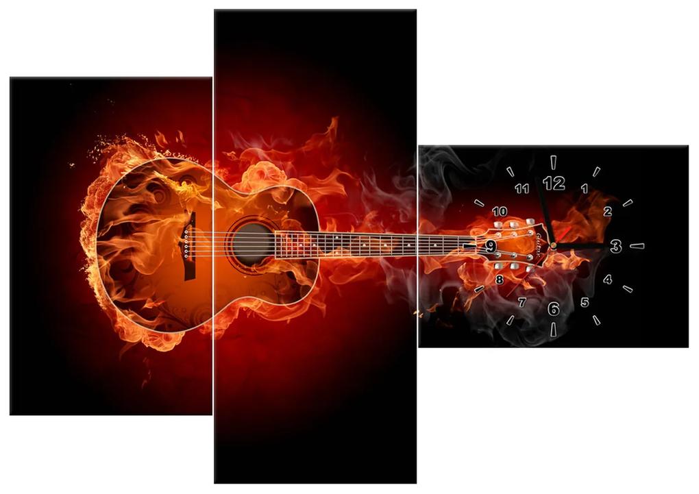 Gario Obraz s hodinami Horiaca gitara - 3 dielny Rozmery: 90 x 30 cm