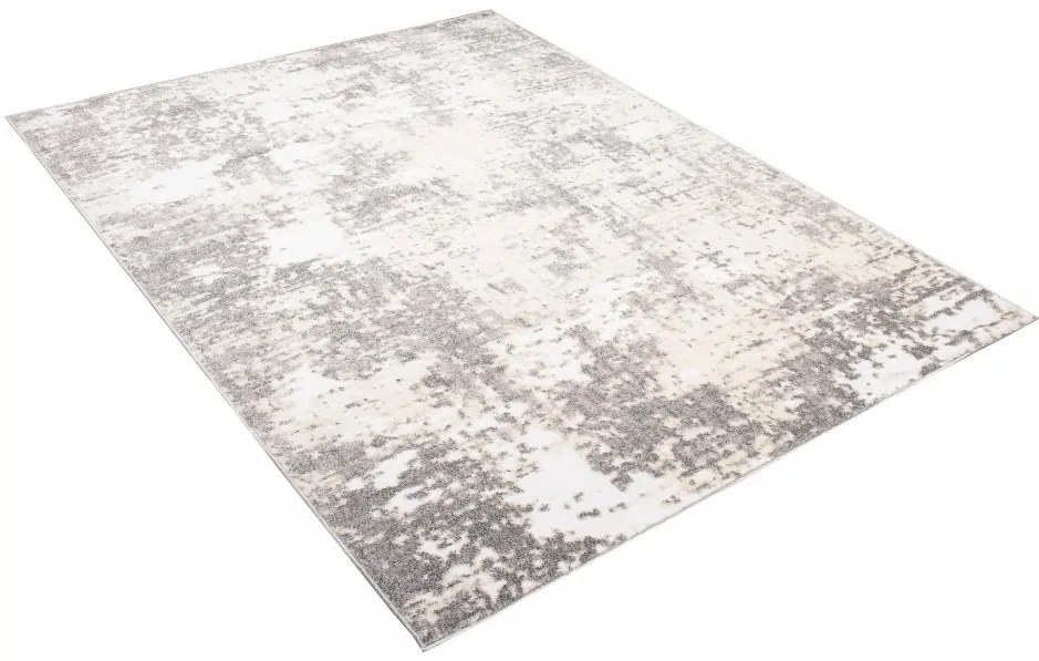 Krémový dizajnový koberec so sivým abstraktným vzorom Šírka: 80 cm | Dĺžka: 150 cm