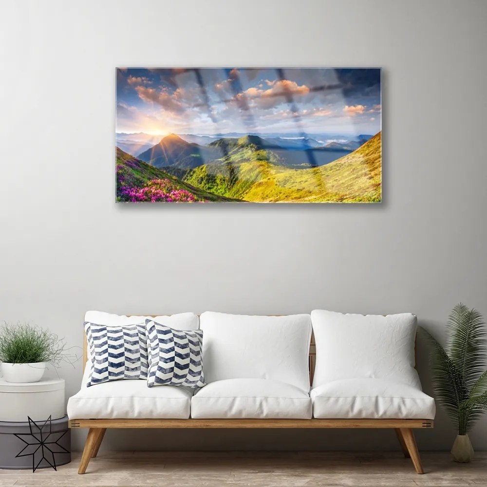 Skleneny obraz Hory slnko lúka krajina 140x70 cm