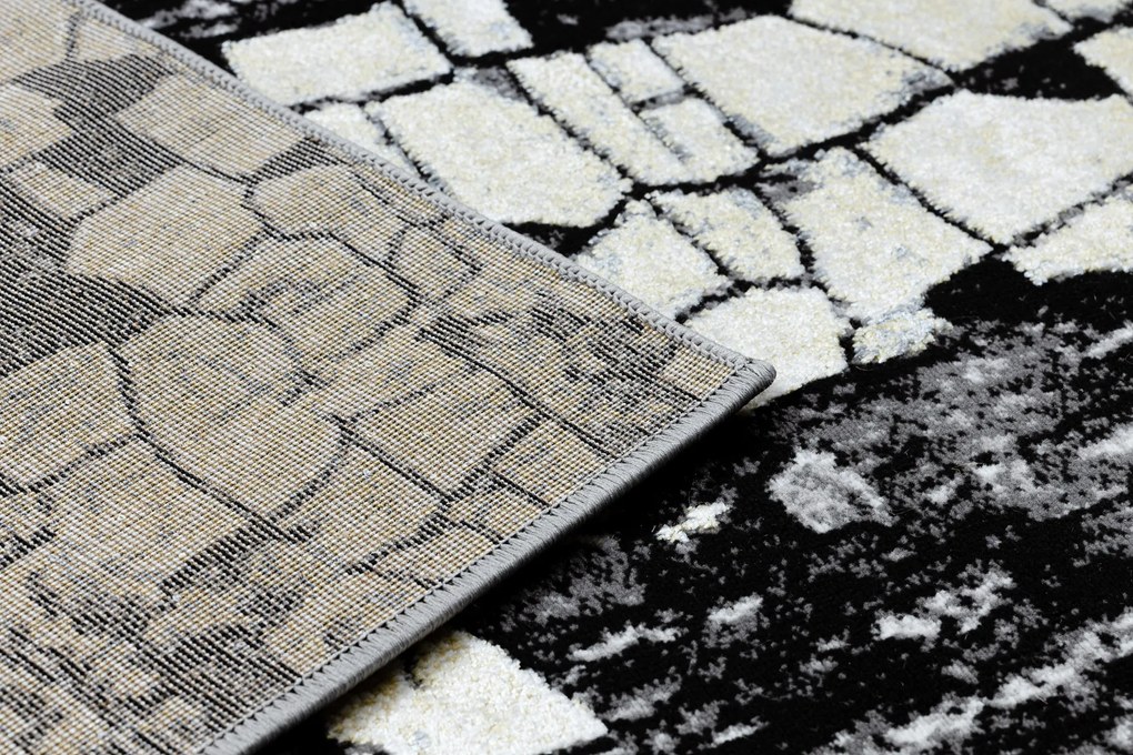 Moderný koberec DE LUXE 2079 Štrukturálny zlatý / sivý