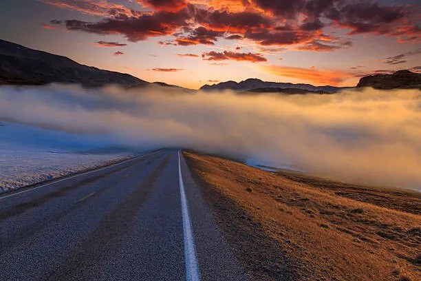 Umelecká fotografie The road in the fog at sunset. Norway, Anton Petrus, (40 x 26.7 cm)