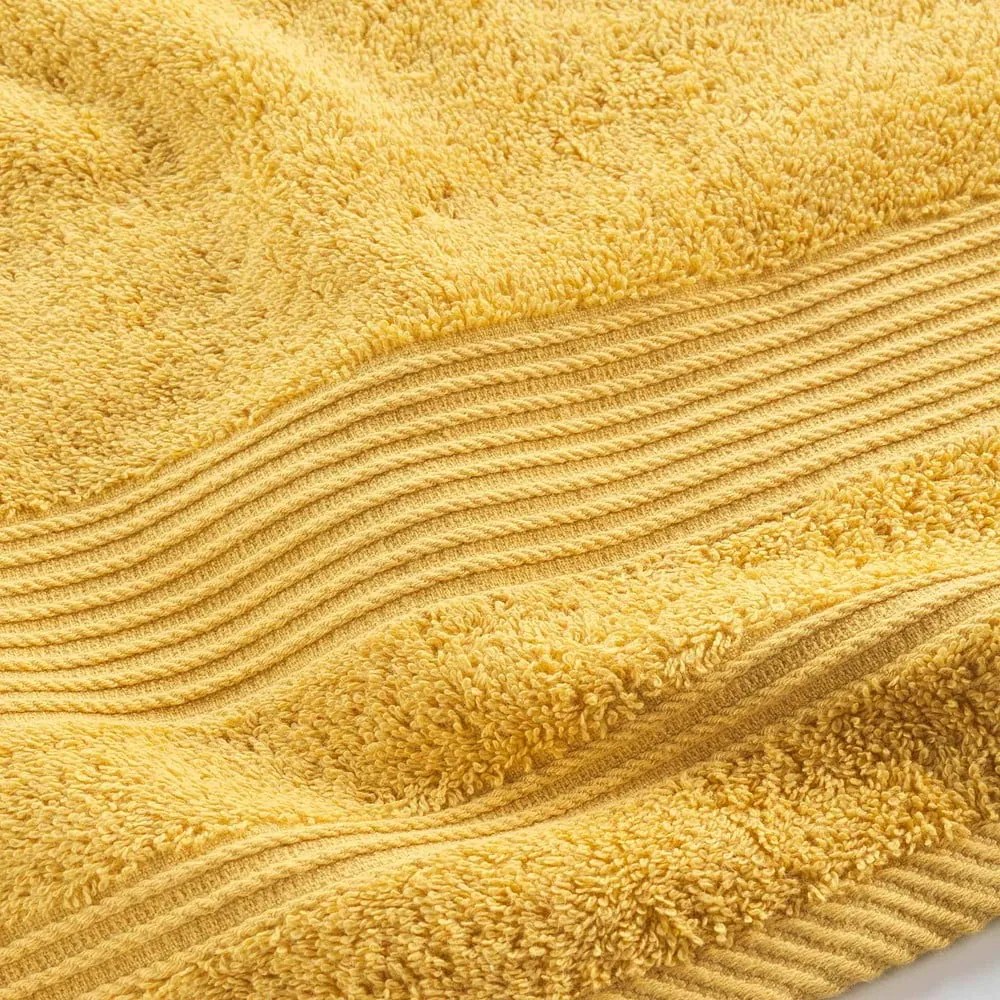 Žltá froté bavlnená osuška 70x130 cm Tendresse – douceur d'intérieur