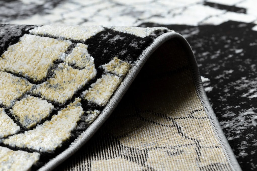 Moderný koberec DE LUXE 2079 Štrukturálny zlatý / sivý