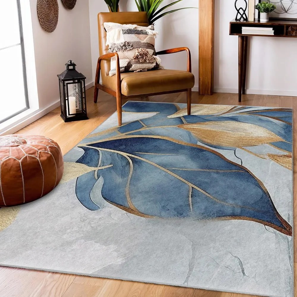 Prateľný koberec v modrej a zlatej farbe 120x180 cm Golden Leaves – Mila Home