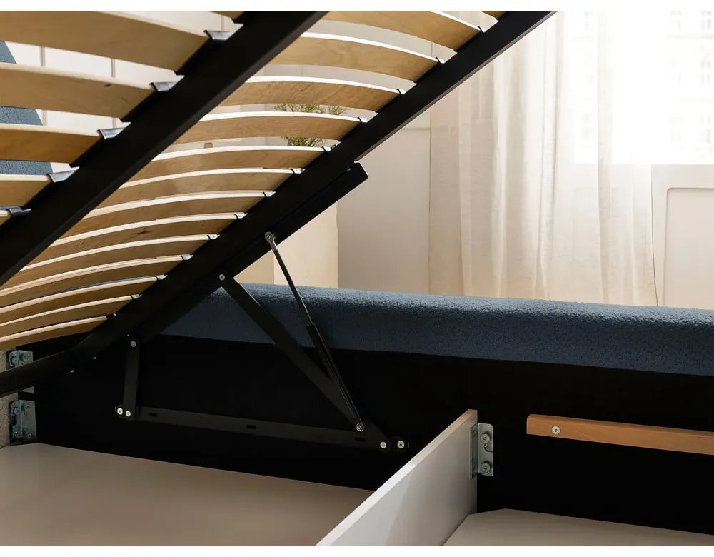 Tmavomodrá čalúnená dvojlôžková posteľ s úložným priestorom s roštom 160x200 cm Orlane – Bobochic Paris