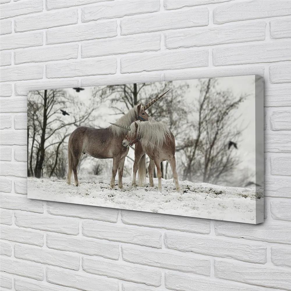 Obraz na plátne Zimný lesné jednorožce 140x70 cm