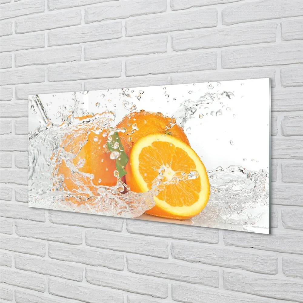 Obraz na skle Pomaranče vo vode 140x70 cm