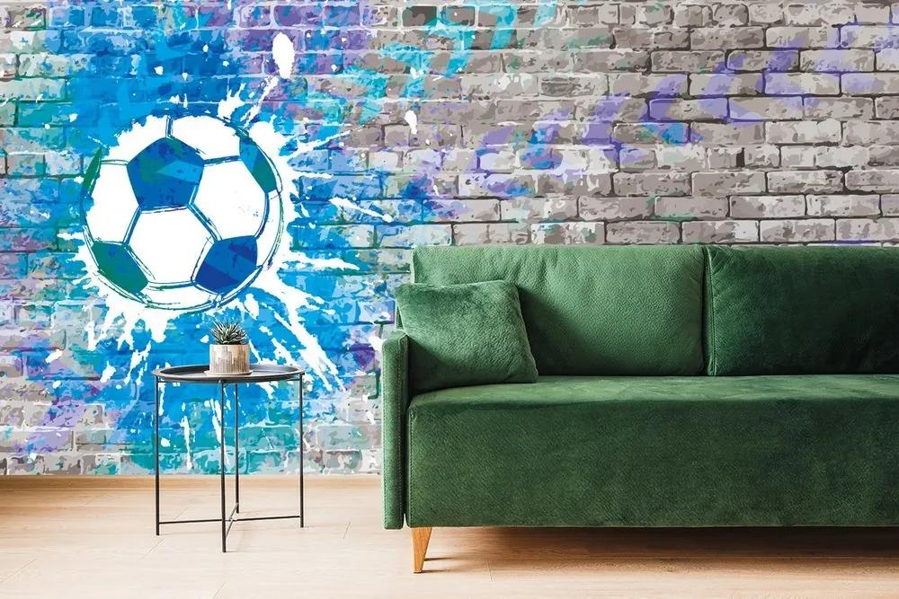 Tapeta modrá futbalová lopta na tehlovej stene - 225x150