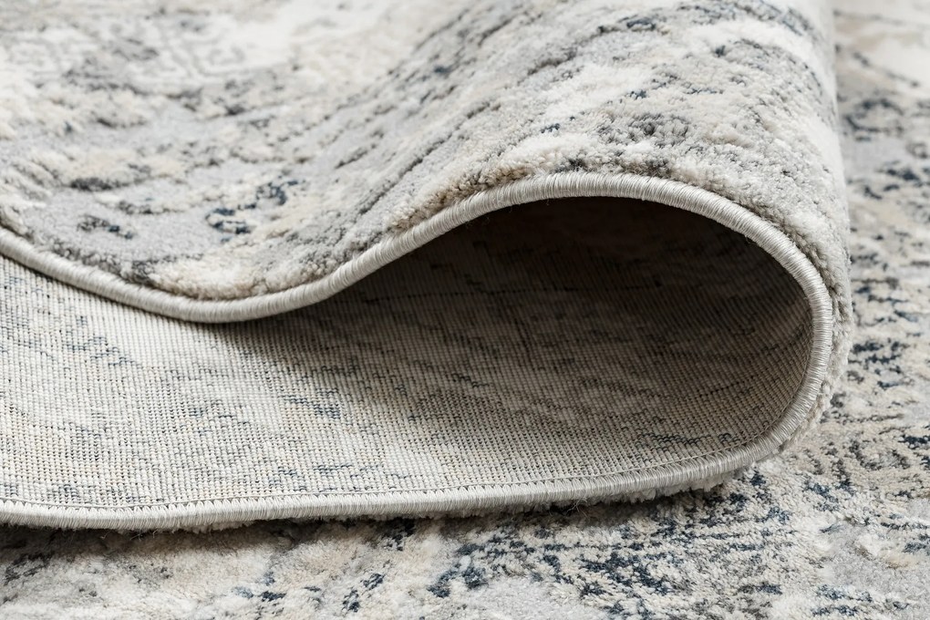 Koberec TULS 51328 s abstraktným vzorom, slonovinová sivá