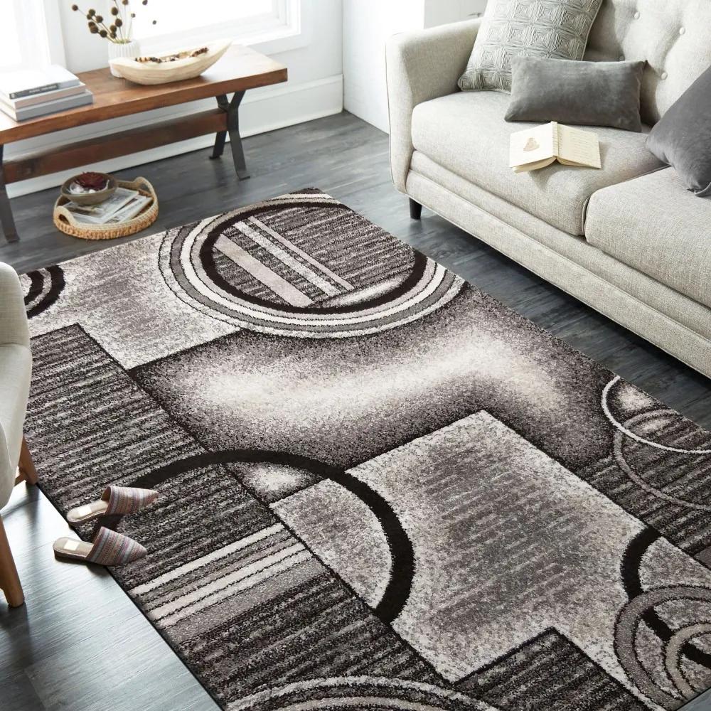 Originálny sivo hnedý koberec s motívom abstraktných kruhov