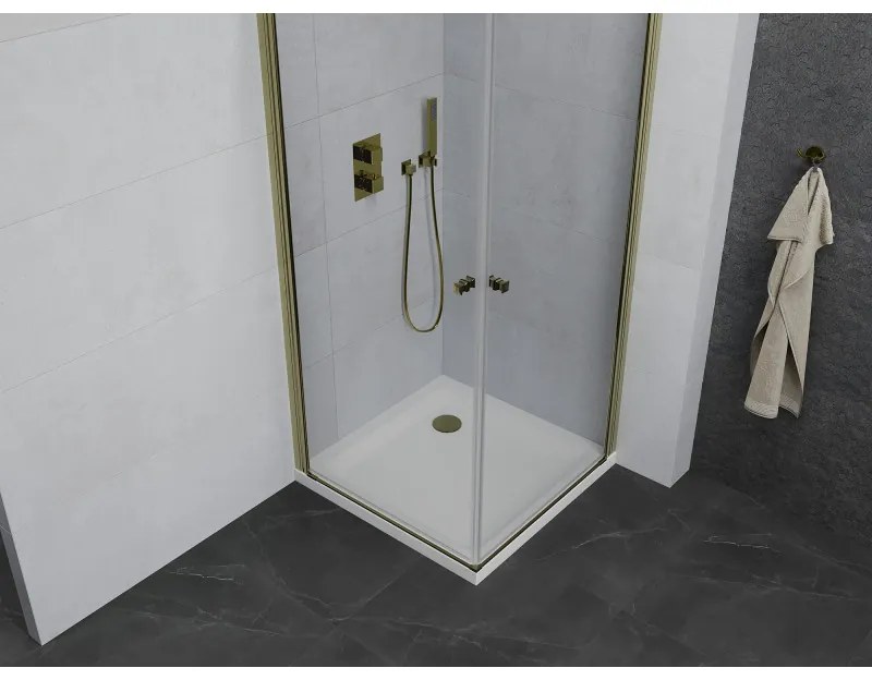 Mexen Pretoria Duo, sprchovací kút s 2-krídlovými dverami 90 (dvere) x 90 (dvere) cm, 6mm číre sklo, zlatý profil + slim sprchová vanička 5cm biela so zlatým sifónom, 852-090-090-50-02-4010G