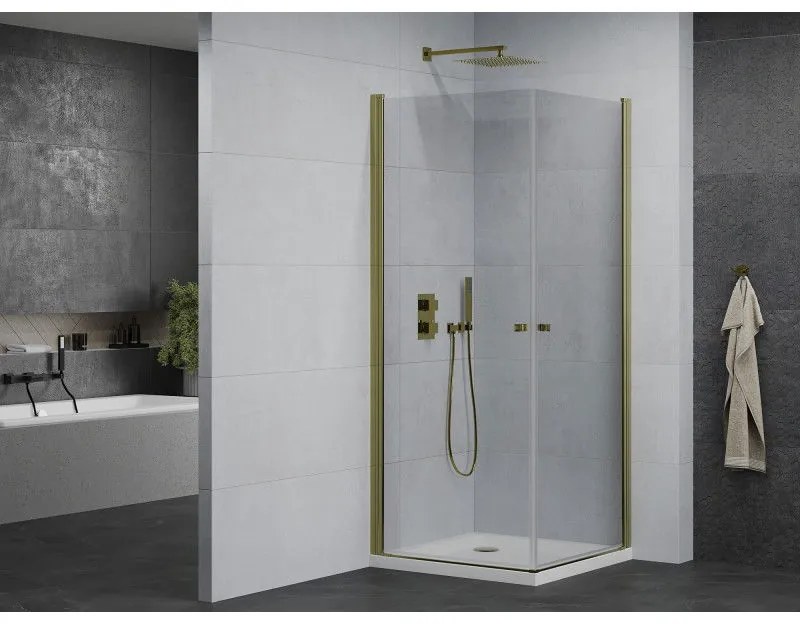 Mexen Pretoria Duo, sprchovací kút s 2-krídlovými dverami 90 (dvere) x 90 (dvere) cm, 6mm číre sklo, zlatý profil + slim sprchová vanička 5cm biela so zlatým sifónom, 852-090-090-50-02-4010G