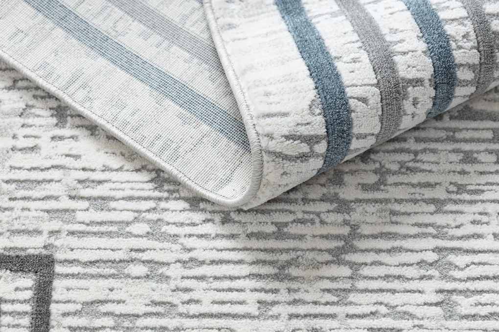 Koberec TULS 51242 s rámikom, slonovinová modrá