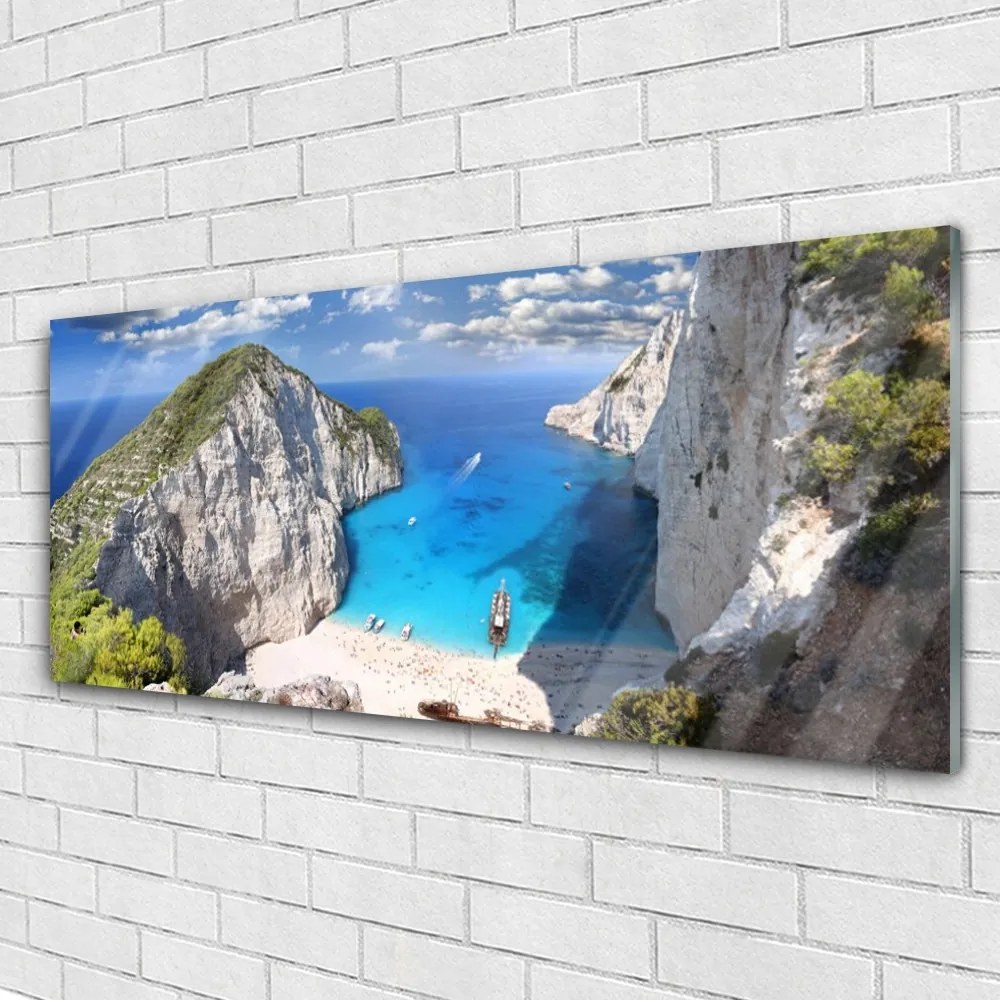 Obraz na akrylátovom skle Záliv hora pláž krajina 125x50 cm