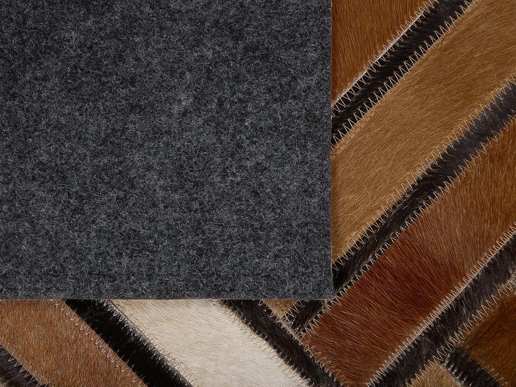 Kožený koberec 140 x 200 cm hnedý TEKIR Beliani
