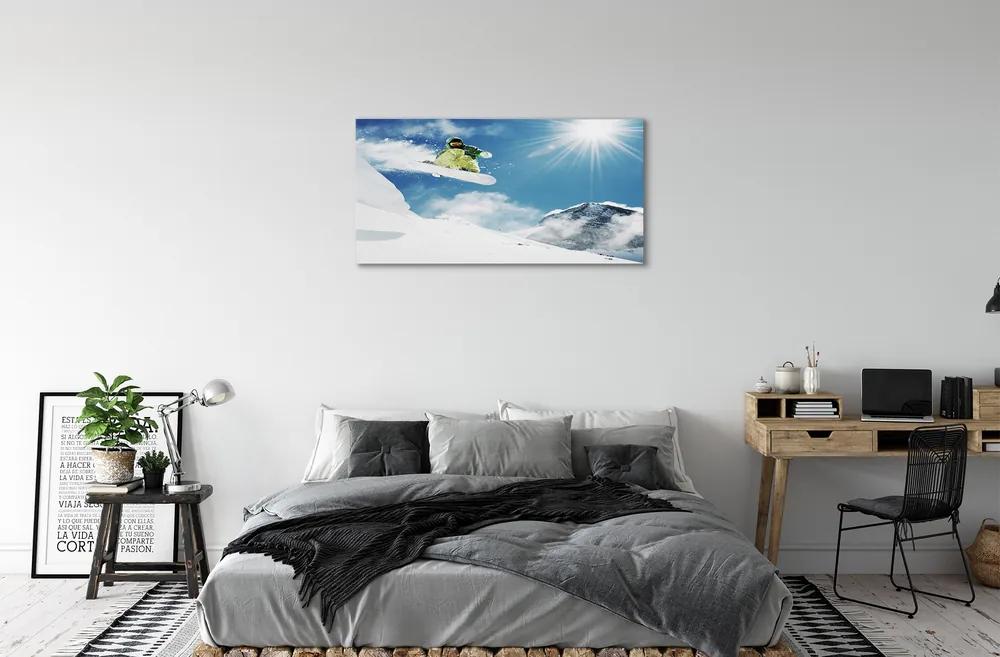 Obraz canvas Man mountain snow board 125x50 cm