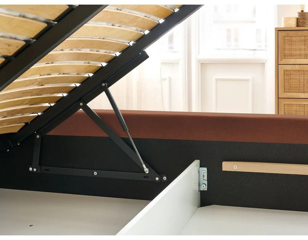 Oranžová čalúnená dvojlôžková posteľ s úložným priestorom s roštom 160x200 cm Jagna – Bobochic Paris