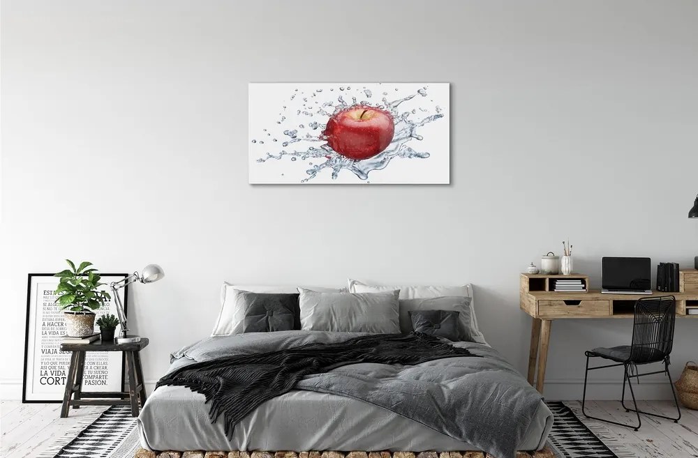 Obraz na skle Červené jablko vo vode 100x50 cm