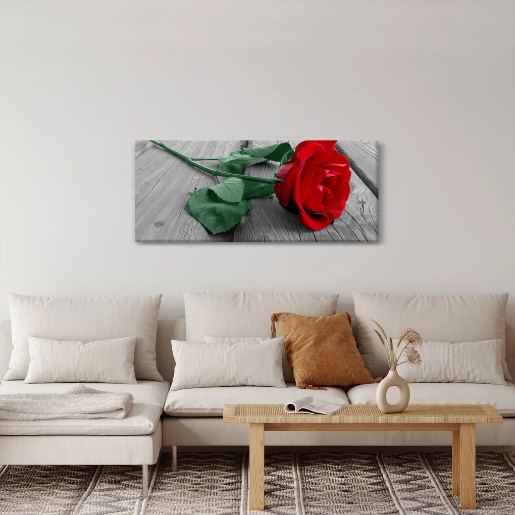 Obraz - Červená ruža so zelenou stonkou (120x50 cm)