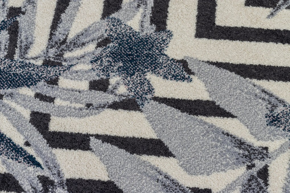 Koberec HEOS 78540 krémovo / modrý LISTY DŽUNGLE