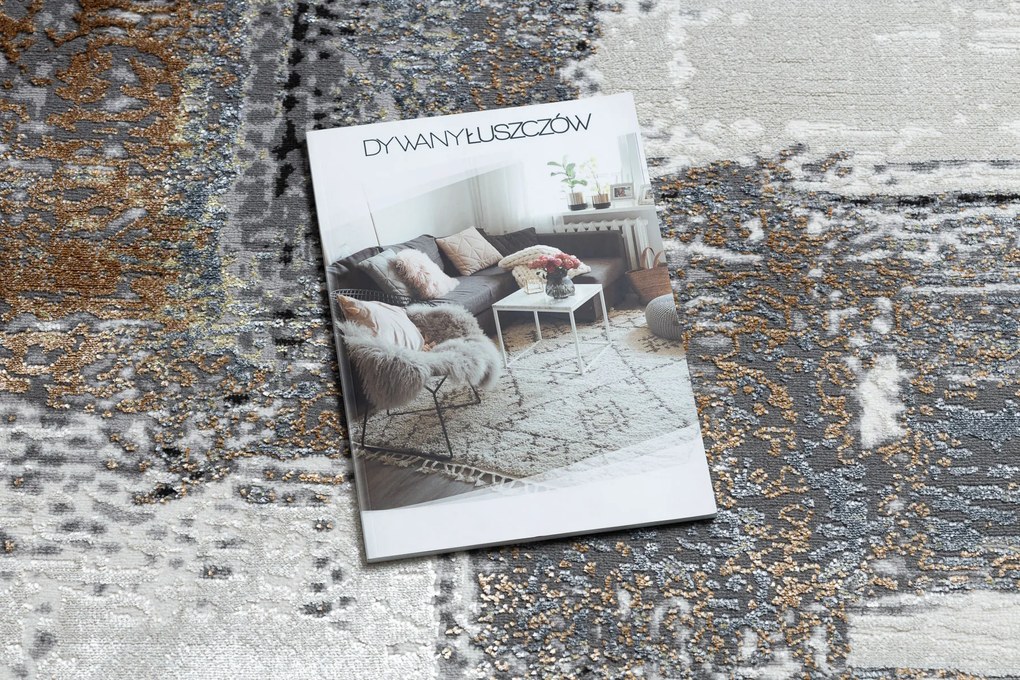 Moderný koberec DE LUXE 633 Abstrakcia - Štrukturálny krém / zlatý