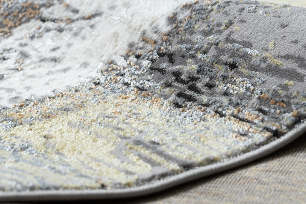 Moderný koberec DE LUXE 633 Abstrakcia - Štrukturálny krém / zlatý