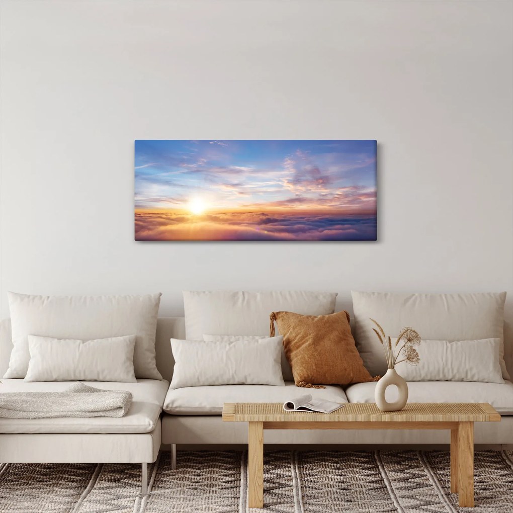 Obraz - Západ slnka nad mrakmi (120x50 cm)