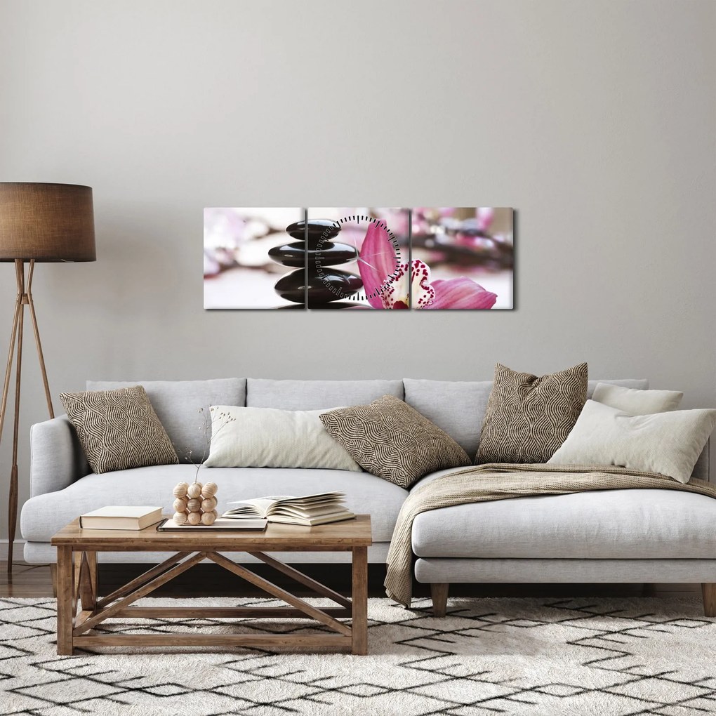 Obraz masážnych kameňov a orchidey na vode (s hodinami) (90x30 cm)