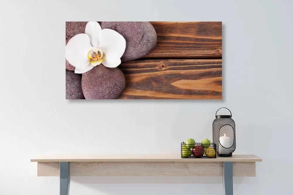 Obraz wellness kamene a orchidea na drevenom pozadí - 100x50