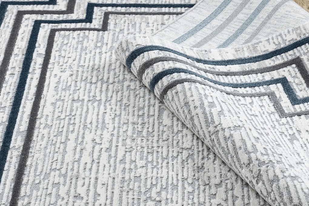 Koberec TULS 51242 s rámikom, slonovinová modrá