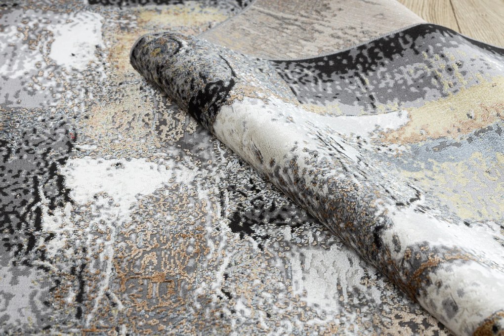 Moderný koberec DE LUXE 633 Abstrakcia - Štrukturálny krém / zlatý