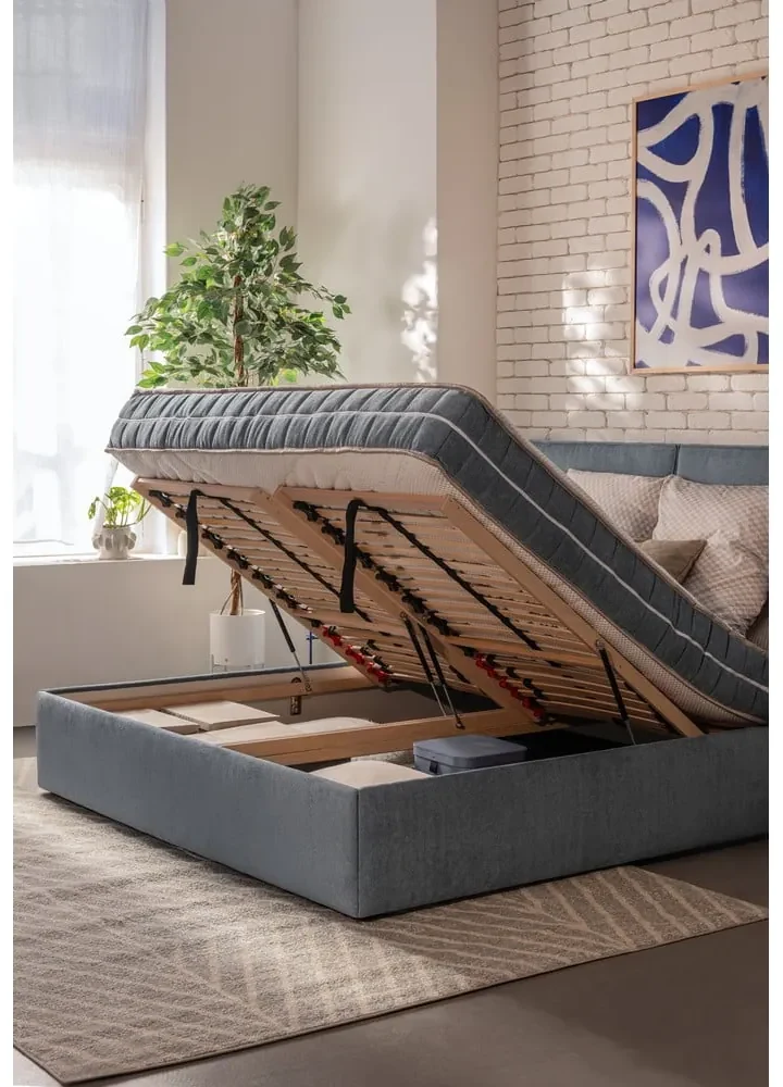 Modrá čalúnená dvojlôžková posteľ s úložným priestorom s roštom 180x200 cm Thessa Bold – Bonami Selection