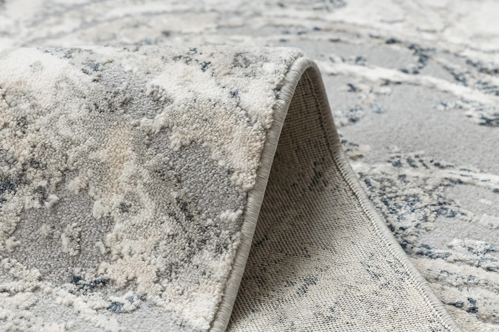 Koberec TULS 51328 s abstraktným vzorom, slonovinová sivá