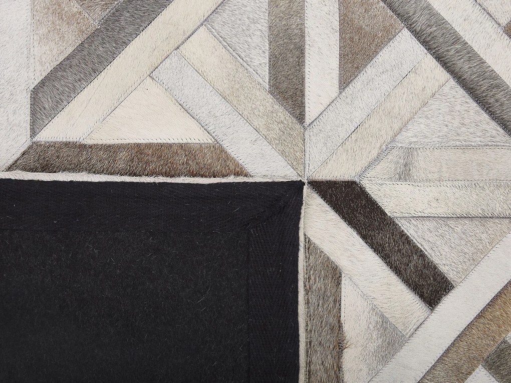Kožený koberec 140 x 200 cm hnedá/béžová TAYTAN Beliani