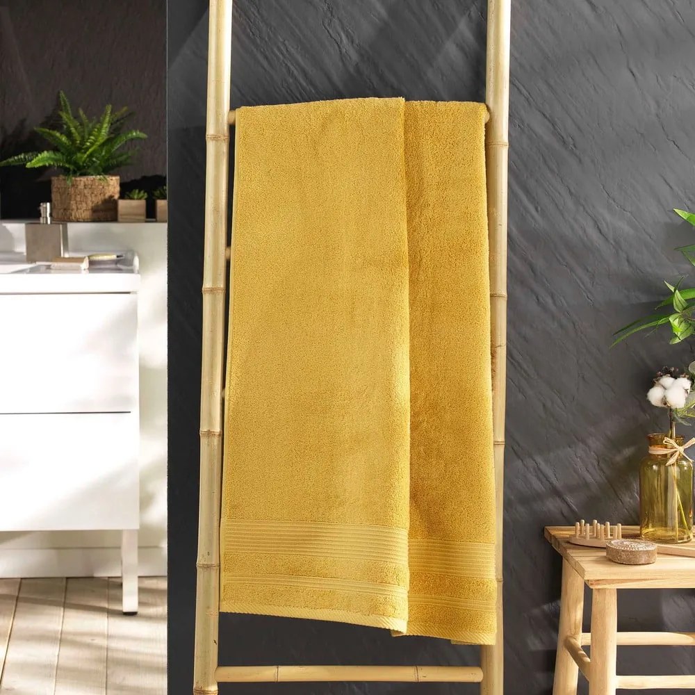 Žltá froté bavlnená osuška 70x130 cm Tendresse – douceur d'intérieur
