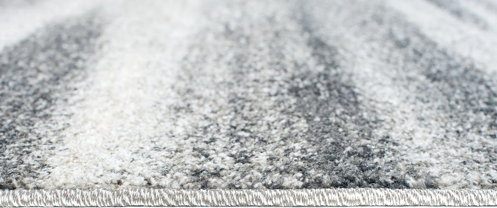 TA Koberec K206A TMAVOSIVÉ SARI B1X Rozmer: 100x250 cm