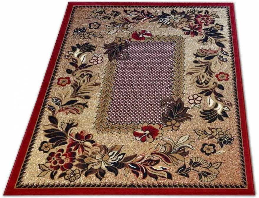 Vintage koberec červenej farby s motívom kvietkov Šírka: 80 cm | Dĺžka: 150 cm