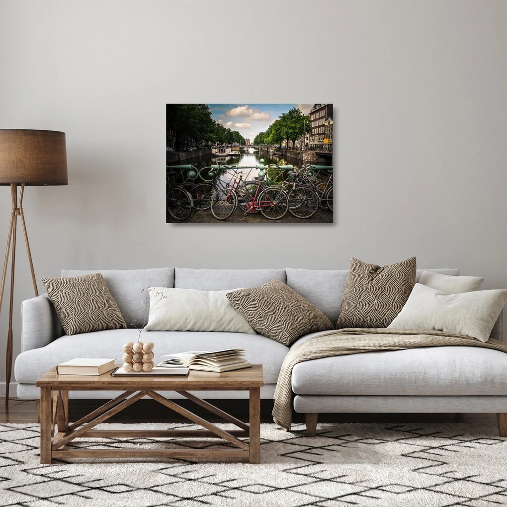 Sklenený obraz bicykla v meste (70x50 cm)